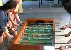 T-girls line down lingerie and stockings playing foosball